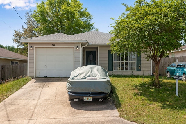 322 Apple Dr, Crestview, FL 32536 - ranch-style home with a garage, a shingled roof, a front yard, fence, and driveway