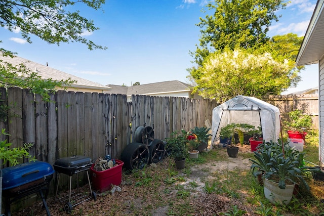 322 Apple Dr, Crestview, FL 32536 - view of yard featuring an outbuilding, a fenced backyard, and an exterior structure