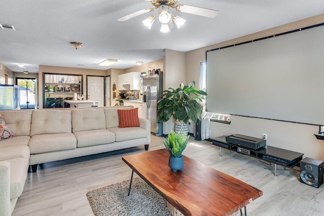 322 Apple Dr, Crestview, FL 32536 - interior space featuring light wood-style flooring, washer / clothes dryer, a ceiling fan, and visible vents