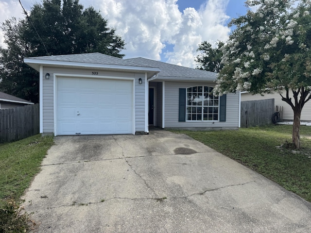322 Apple Dr, Crestview, FL 32536 - ranch-style home featuring driveway, an attached garage, and roof with shingles