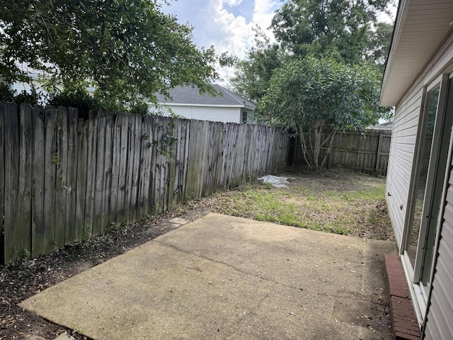 322 Apple Dr, Crestview, FL 32536 - fenced backyard with a patio area