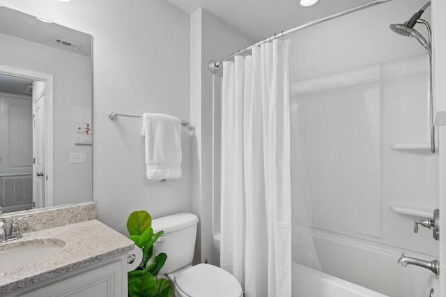 full bath featuring toilet, visible vents, shower / tub combo, and vanity