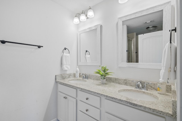 bathroom featuring double vanity and a sink