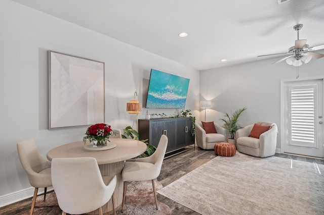 dining space featuring wood finished floors, baseboards, a ceiling fan, and recessed lighting