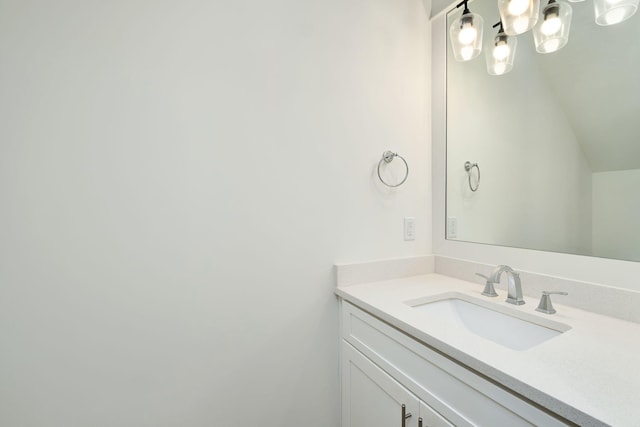 bathroom featuring a chandelier and vanity