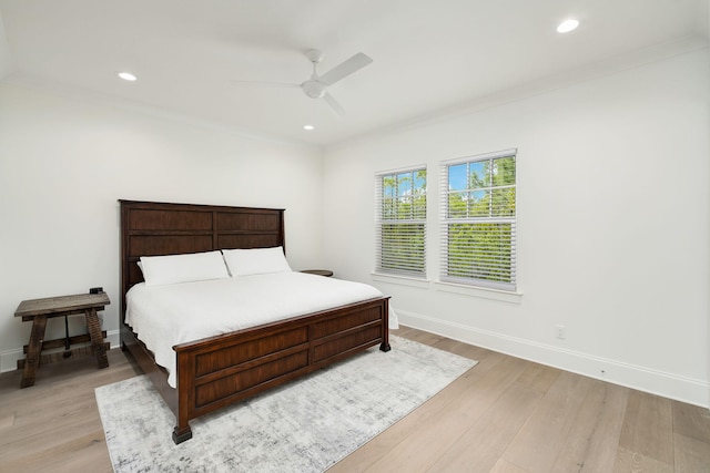 bedroom featuring crown molding, recessed lighting, light wood-style flooring, and baseboards