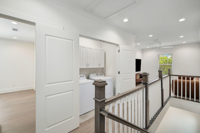 stairway featuring recessed lighting, washing machine and dryer, a ceiling fan, visible vents, and wood finished floors