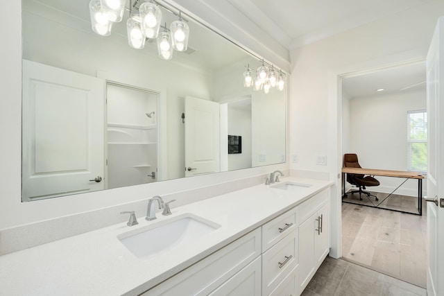 full bathroom with tile patterned floors, double vanity, and a sink