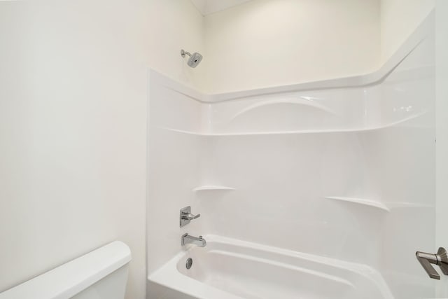 bathroom with toilet and shower / bath combination