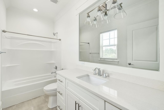 bathroom featuring visible vents, tub / shower combination, toilet, wood finished floors, and vanity