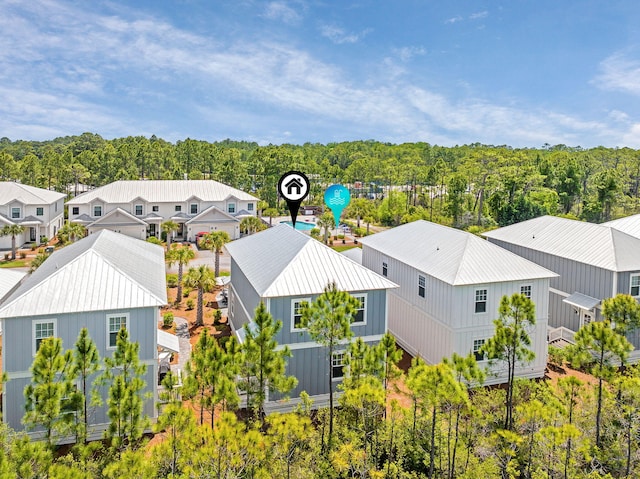 aerial view featuring a residential view and a view of trees