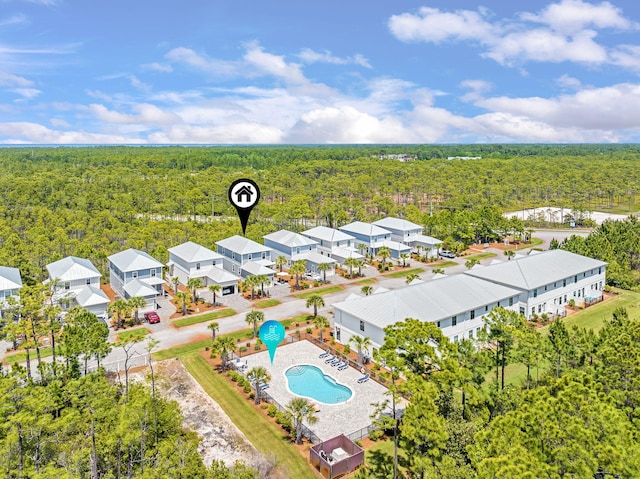 bird's eye view featuring a wooded view