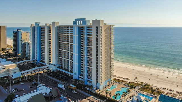 birds eye view of property featuring a water view and a view of the beach