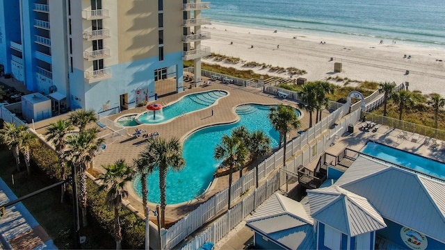 bird's eye view featuring a water view and a view of the beach