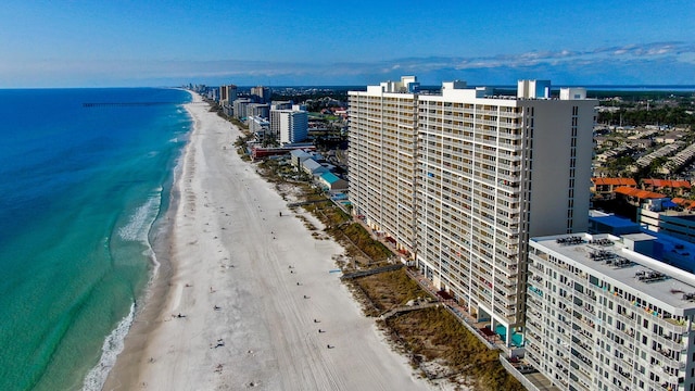 birds eye view of property with a view of city, a beach view, and a water view