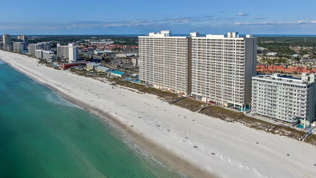 birds eye view of property featuring a view of the beach and a water view