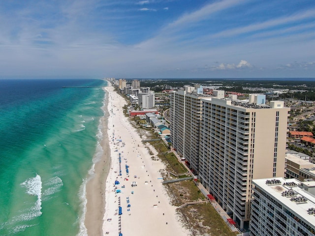 birds eye view of property featuring a view of the beach and a water view