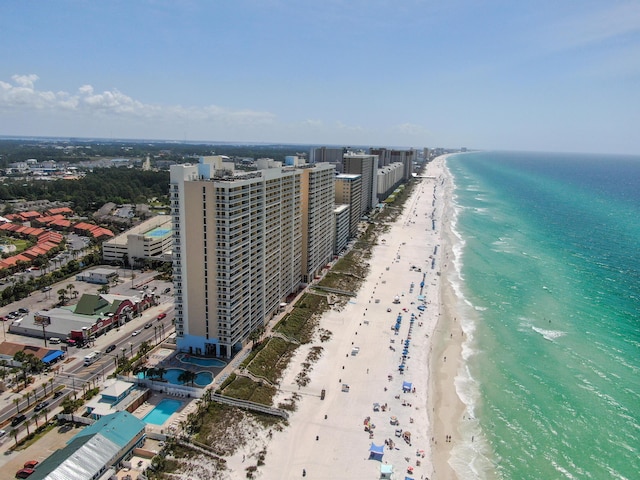 bird's eye view featuring a water view and a view of the beach