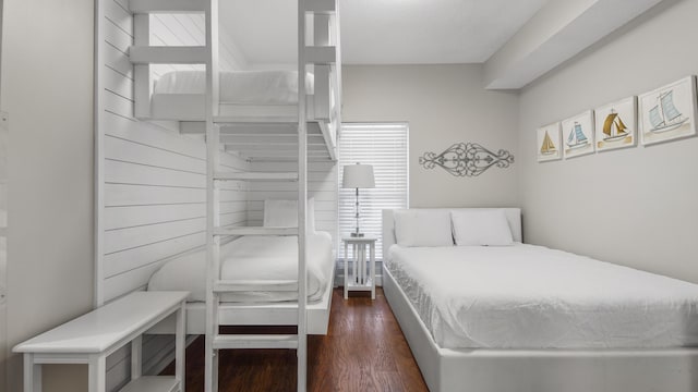 bedroom with dark wood-type flooring