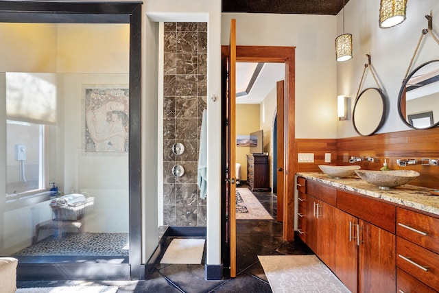 100 Vista Blfs, Destin, FL 32541 - full bathroom featuring double vanity, wainscoting, a sink, and walk in shower
