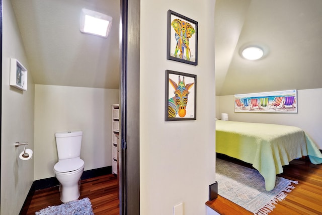 100 Vista Blfs, Destin, FL 32541 - bedroom featuring baseboards, wood finished floors, and lofted ceiling