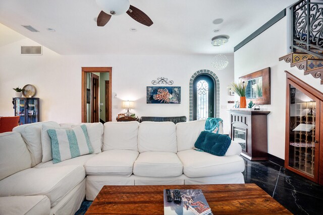 100 Vista Blfs, Destin, FL 32541 - living room featuring visible vents, baseboards, a ceiling fan, and stairs