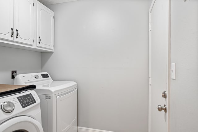 119 Long Pointe Dr, Mary Esther, FL 32569 - laundry room featuring cabinet space and washing machine and dryer