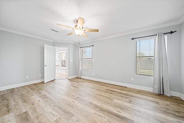 119 Long Pointe Dr, Mary Esther, FL 32569 - spare room featuring ceiling fan, plenty of natural light, ornamental molding, light wood-style floors, and a textured ceiling
