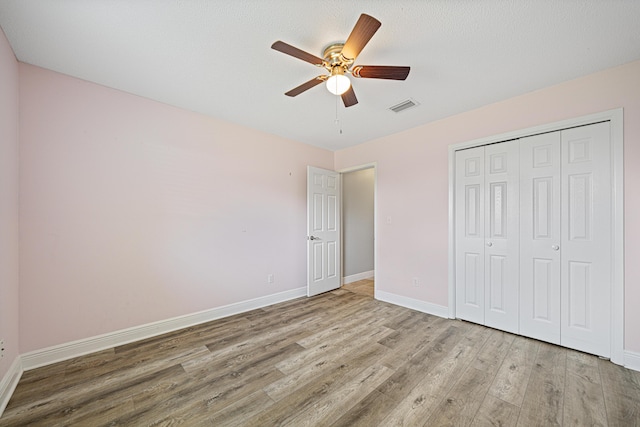 119 Long Pointe Dr, Mary Esther, FL 32569 - unfurnished bedroom featuring wood finished floors, a closet, and ceiling fan