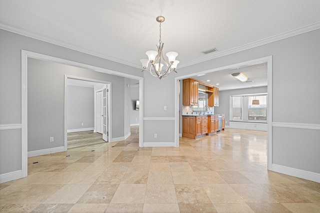 119 Long Pointe Dr, Mary Esther, FL 32569 - kitchen with brown cabinetry, a chandelier, ornamental molding, decorative light fixtures, and light countertops