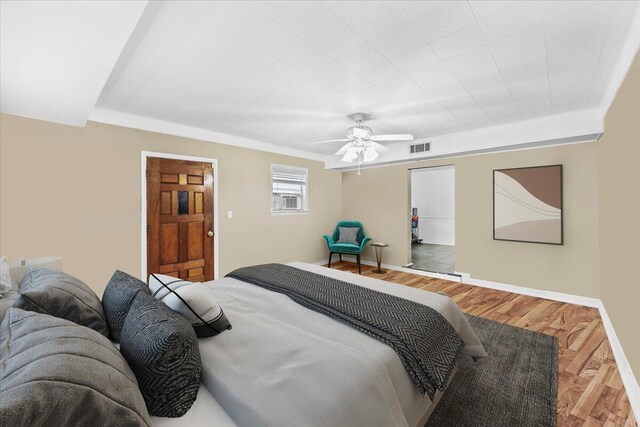 706 Mary Ave, Fort Walton Beach, FL 32547 - bedroom with baseboards, visible vents, wood finished floors, and a ceiling fan