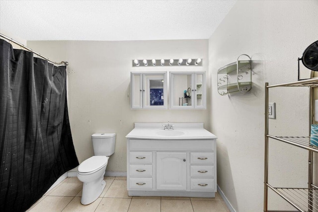 706 Mary Ave, Fort Walton Beach, FL 32547 - bathroom featuring vanity, tile patterned floors, toilet, baseboards, and a textured ceiling