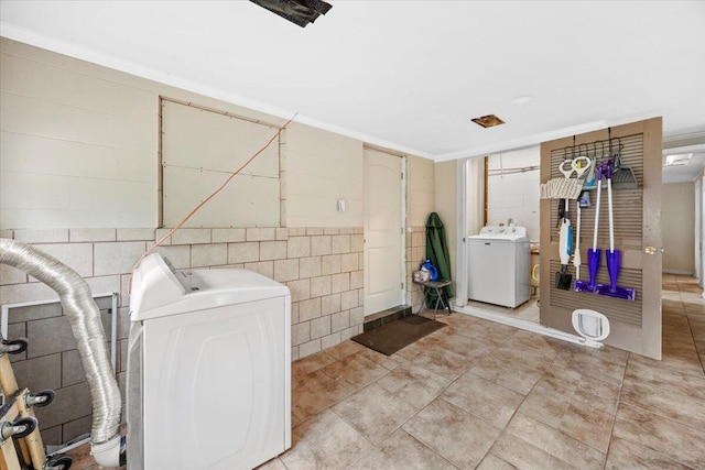 706 Mary Ave, Fort Walton Beach, FL 32547 - laundry area with tile walls, separate washer and dryer, and laundry area