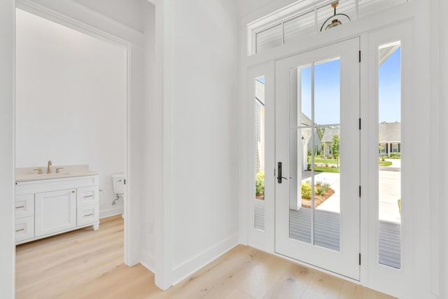 63 W Firethorn Cir Lot 65, Watersound, FL 32461 - entryway with light wood finished floors and baseboards