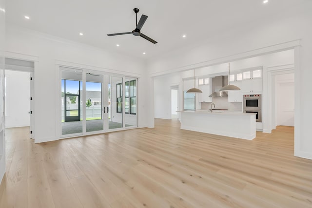 63 W Firethorn Cir Lot 65, Watersound, FL 32461 - unfurnished living room with ceiling fan, light wood-style floors, and recessed lighting