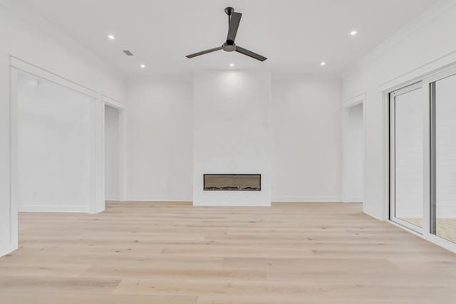 63 W Firethorn Cir Lot 65, Watersound, FL 32461 - unfurnished living room with light wood-type flooring, ceiling fan, a fireplace, and recessed lighting