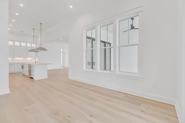 63 W Firethorn Cir Lot 65, Watersound, FL 32461 - unfurnished living room with light wood-style flooring and recessed lighting