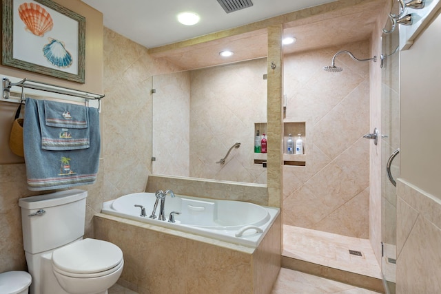 bathroom with toilet, tile walls, a tile shower, and a bath
