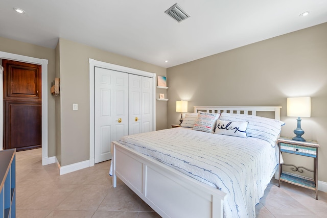 bedroom with visible vents, a closet, baseboards, recessed lighting, and light tile patterned floors
