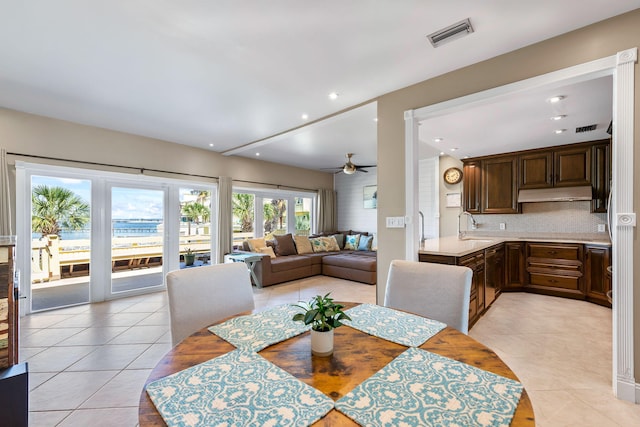 dining space with light tile patterned flooring, ceiling fan, visible vents, and recessed lighting