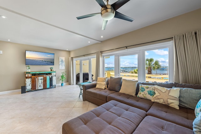 living area featuring baseboards, recessed lighting, ceiling fan, and light tile patterned floors