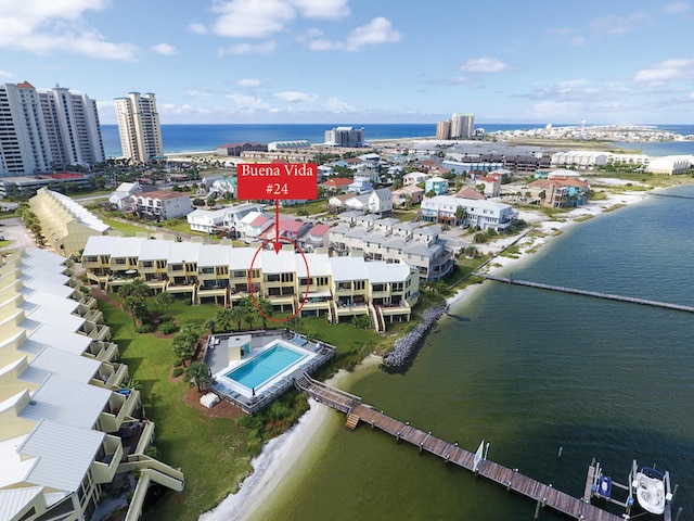 drone / aerial view featuring a water view and a view of city