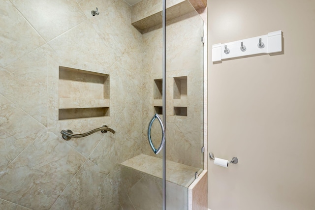 full bathroom with a tile shower
