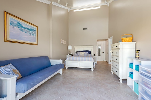 bedroom featuring crown molding, light tile patterned flooring, and visible vents