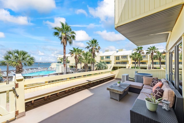 view of patio / terrace featuring central AC unit and a residential view