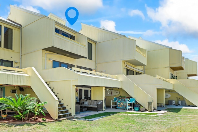 exterior space with stairway, a patio, and outdoor lounge area
