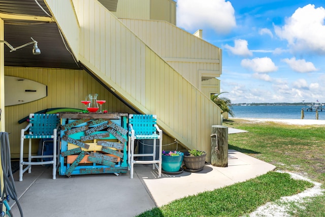 view of patio featuring a water view
