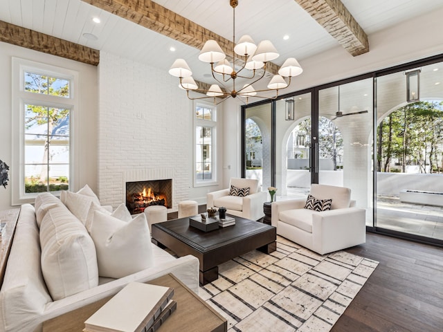 335 Churchill Oaks Dr, Santa Rosa Beach, FL 32459 - living room featuring a healthy amount of sunlight, a brick fireplace, beam ceiling, and hardwood / wood-style floors