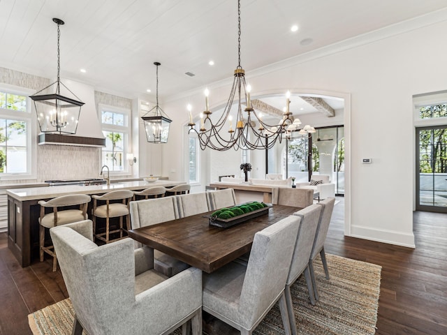 335 Churchill Oaks Dr, Santa Rosa Beach, FL 32459 - dining room featuring dark wood-type flooring, a healthy amount of sunlight, and an inviting chandelier