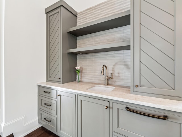 335 Churchill Oaks Dr, Santa Rosa Beach, FL 32459 - bar featuring dark wood-style flooring, baseboards, a sink, and tasteful backsplash